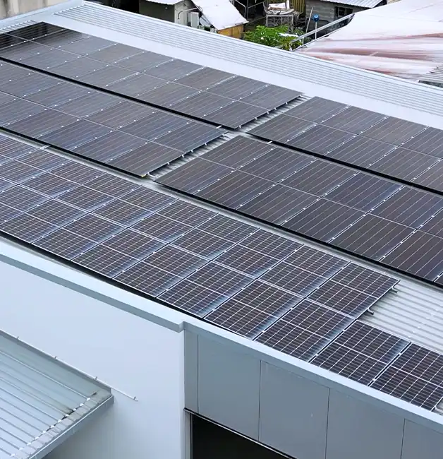 Rows of solar panels mounted on a commercial metal roof
